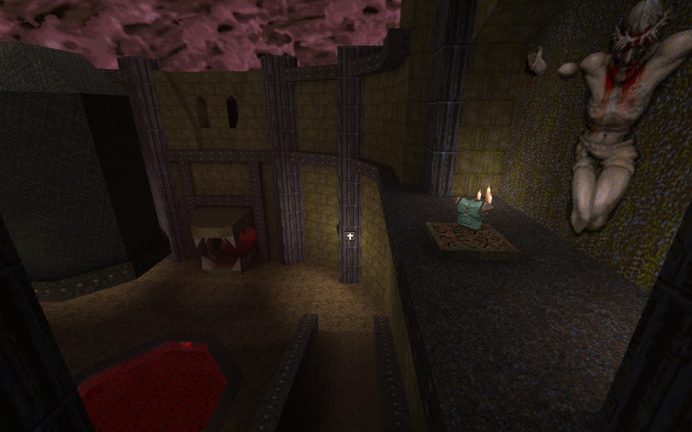 Screenshot of Quake, previewing the gateway (in the shape of a dog's mouth) and a green armor pick-up.