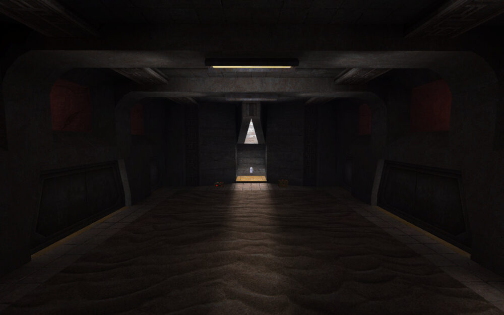 Screenshot of Quake, showing the silver keycard at the end of a sand-covered room.