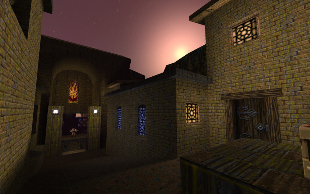 Screenshot from Quake, showing a straight path through a "street" with doors and windows.