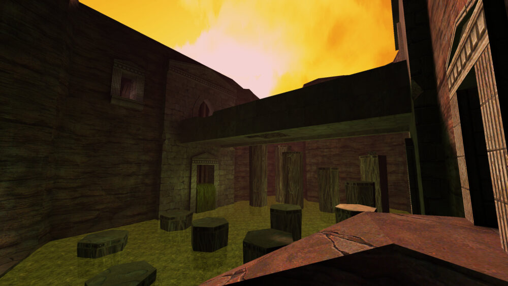 Screenshot from Quake, Arcane Dimensions, showing a bridge above a green acid pool in a red rock canyon.